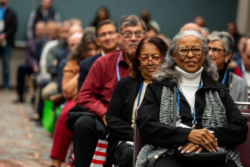 Room full of attendees attending a session.